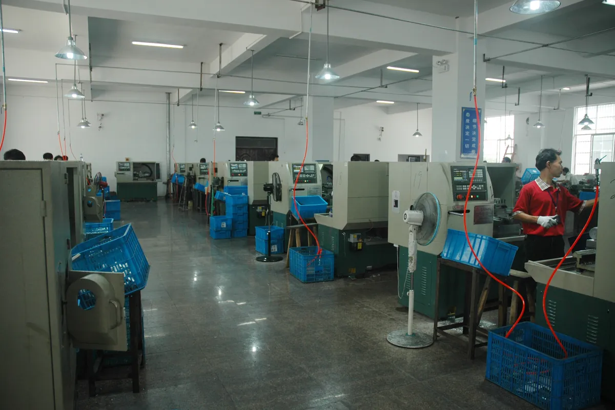 CNC lathes machining flashlight housings on the PLD production floor