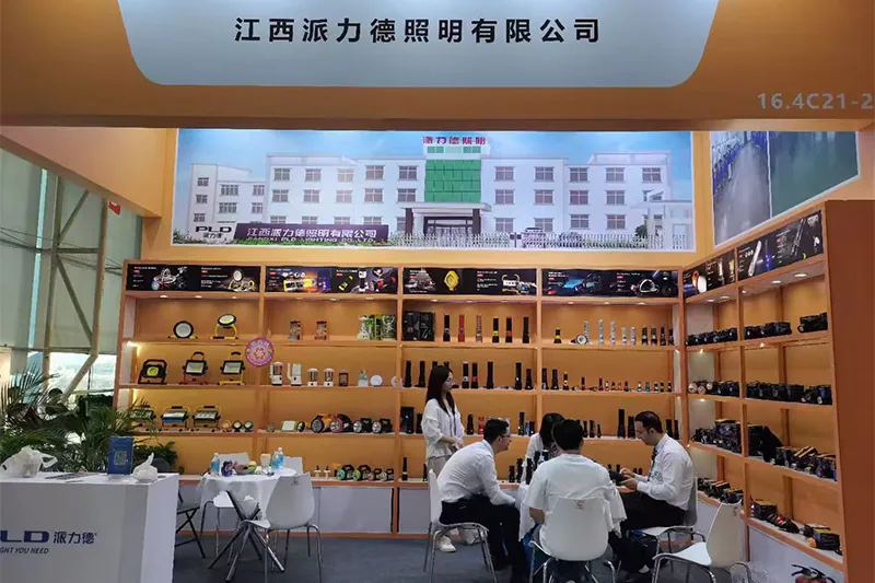 PLD LED booth at China Import and Export Fair (Canton Fair) 2026 with the product wall and buyers at the table